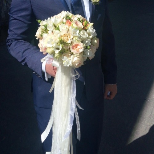 Bridal bouquet of light colour flowers